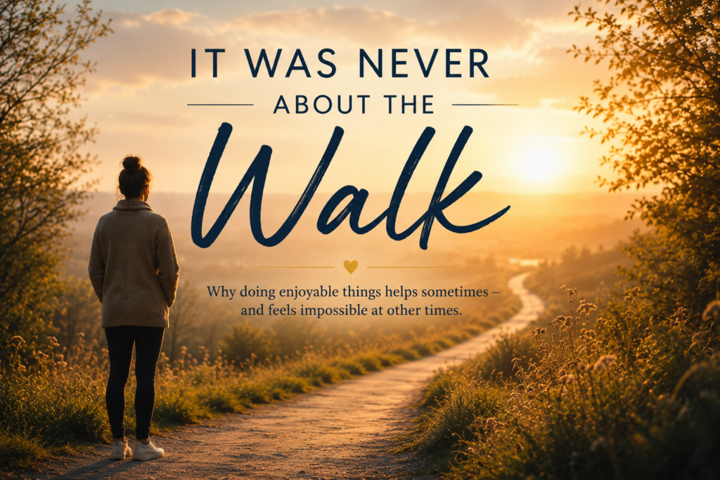 A solitary walking path opening into light, but with a subtle human silhouette paused at the beginning rather than already walking. Emotional tone: possibility, not pressure.